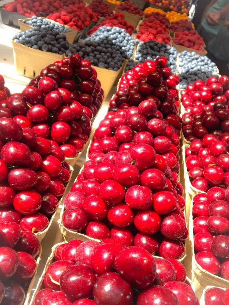 cherries stacked at the market