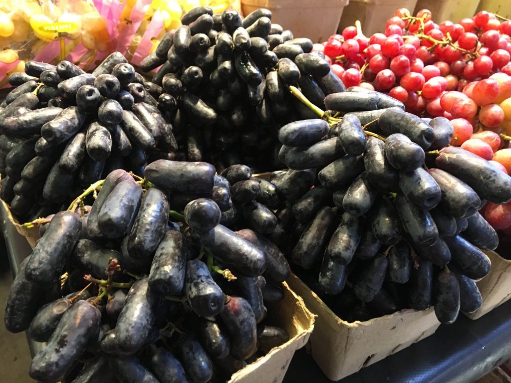 long black grapes at market